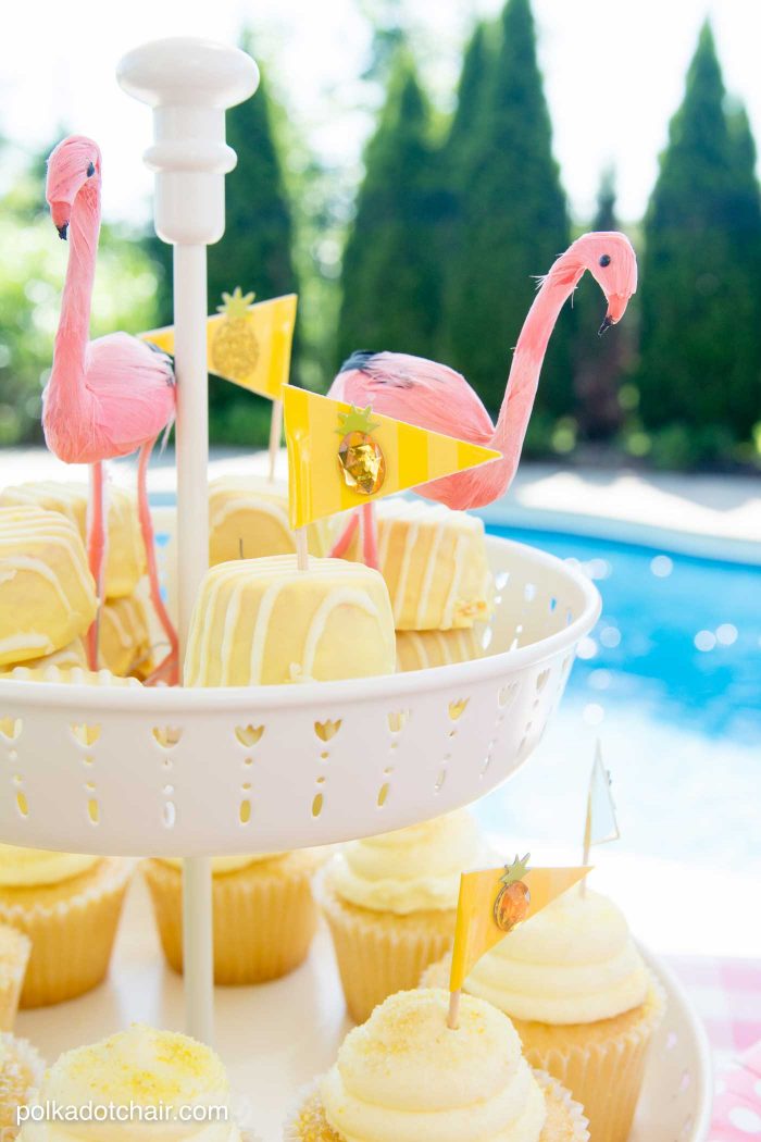 Lots of fun ideas to throw a backyard flamingo themed pool party, including free printable silverware containers and a recipe for pineapple and mango virgin pina coladas 