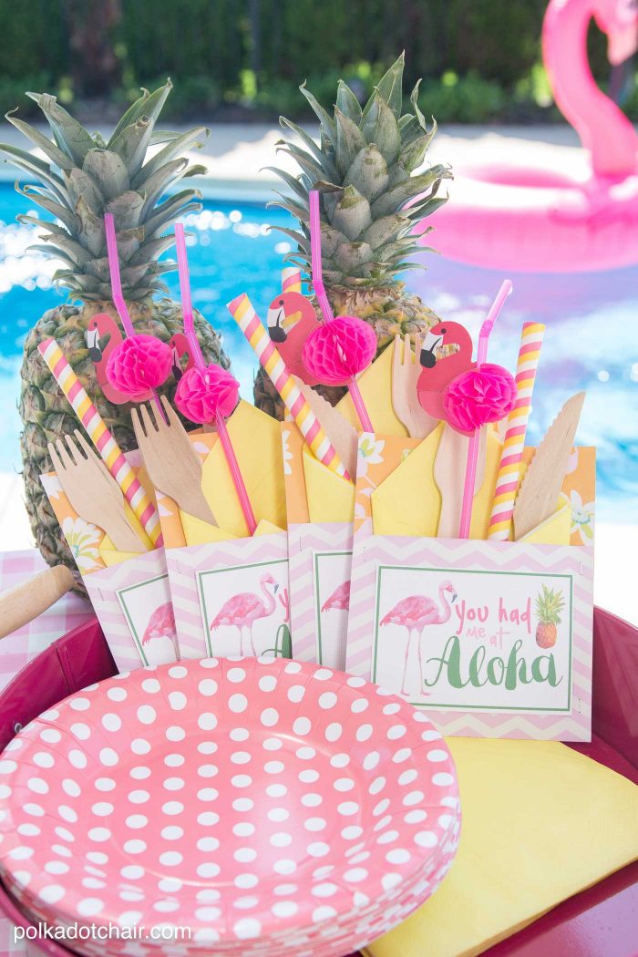 Lots of fun ideas to throw a backyard flamingo themed pool party, including free printable silverware containers and a recipe for pineapple and mango virgin pina coladas 