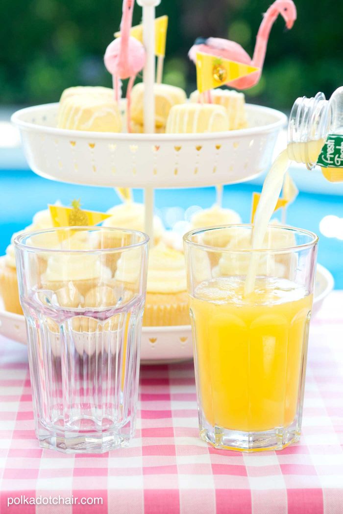 Lots of fun ideas to throw a backyard flamingo themed pool party, including free printable silverware containers and a recipe for pineapple and mango virgin pina coladas 