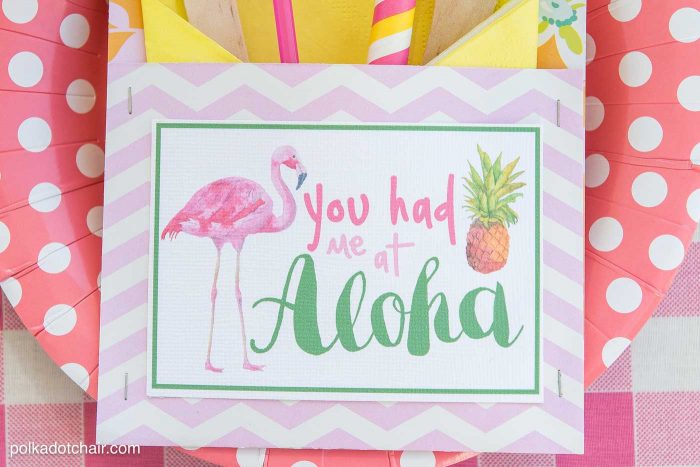 Lots of fun ideas to throw a backyard flamingo themed pool party, including free printable silverware containers and a recipe for pineapple and mango virgin pina coladas 