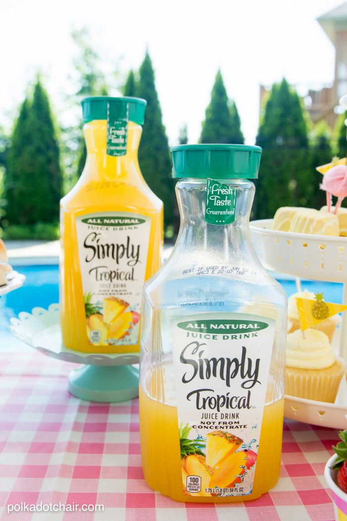 Lots of fun ideas to throw a backyard flamingo themed pool party, including free printable silverware containers and a recipe for pineapple and mango virgin pina coladas 