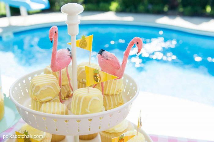 Lots of fun ideas to throw a backyard flamingo themed pool party, including free printable silverware containers and a recipe for pineapple and mango virgin pina coladas 