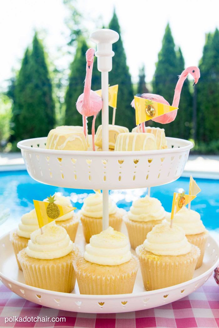 Lots of fun ideas to throw a backyard flamingo themed pool party, including free printable silverware containers and a recipe for pineapple and mango virgin pina coladas 