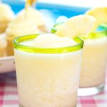 Lots of fun ideas to throw a backyard flamingo themed pool party, including free printable silverware containers and a recipe for pineapple and mango virgin pina coladas