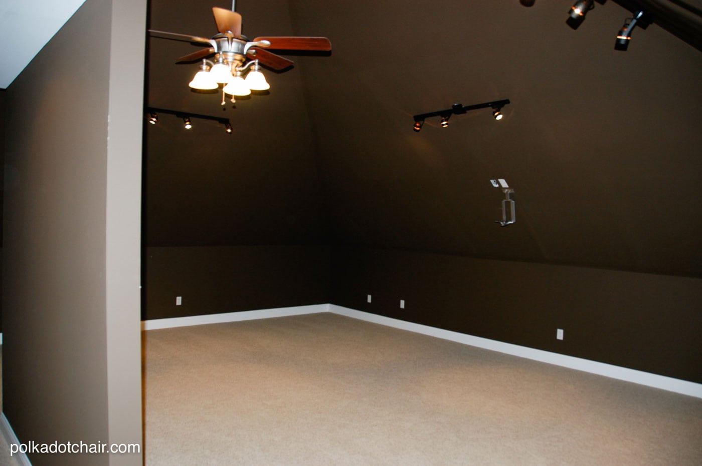 Empty room with dark brown walls
