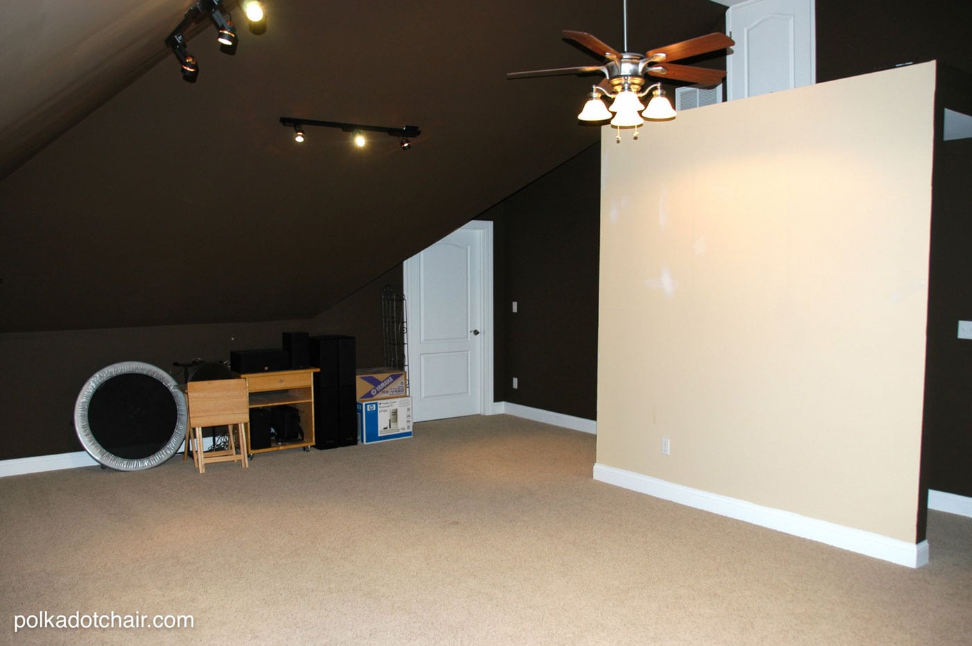 Empty room with dark brown walls