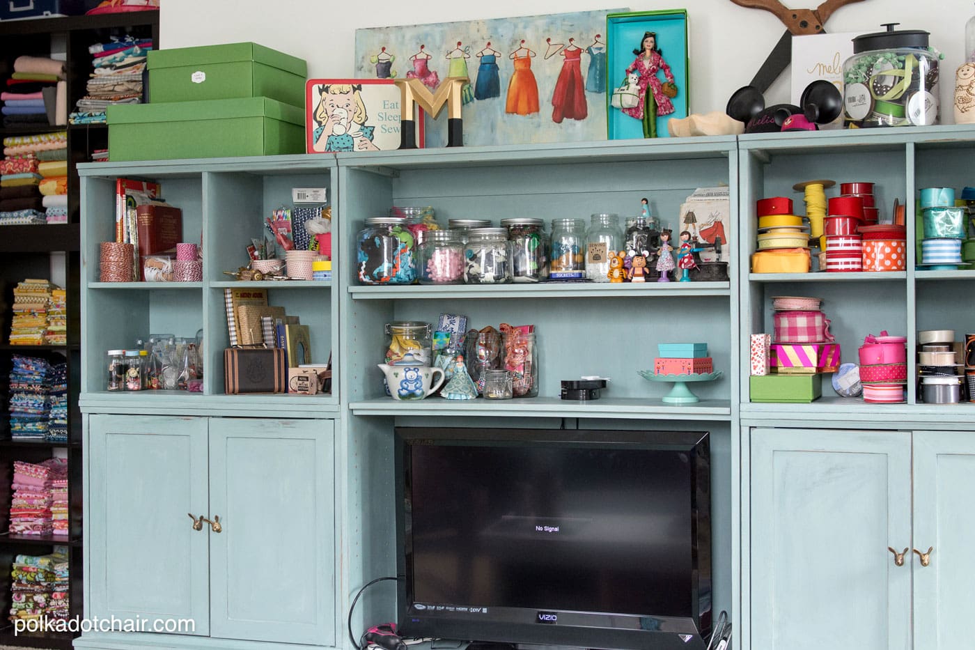 Blue book shelves with craft supplies