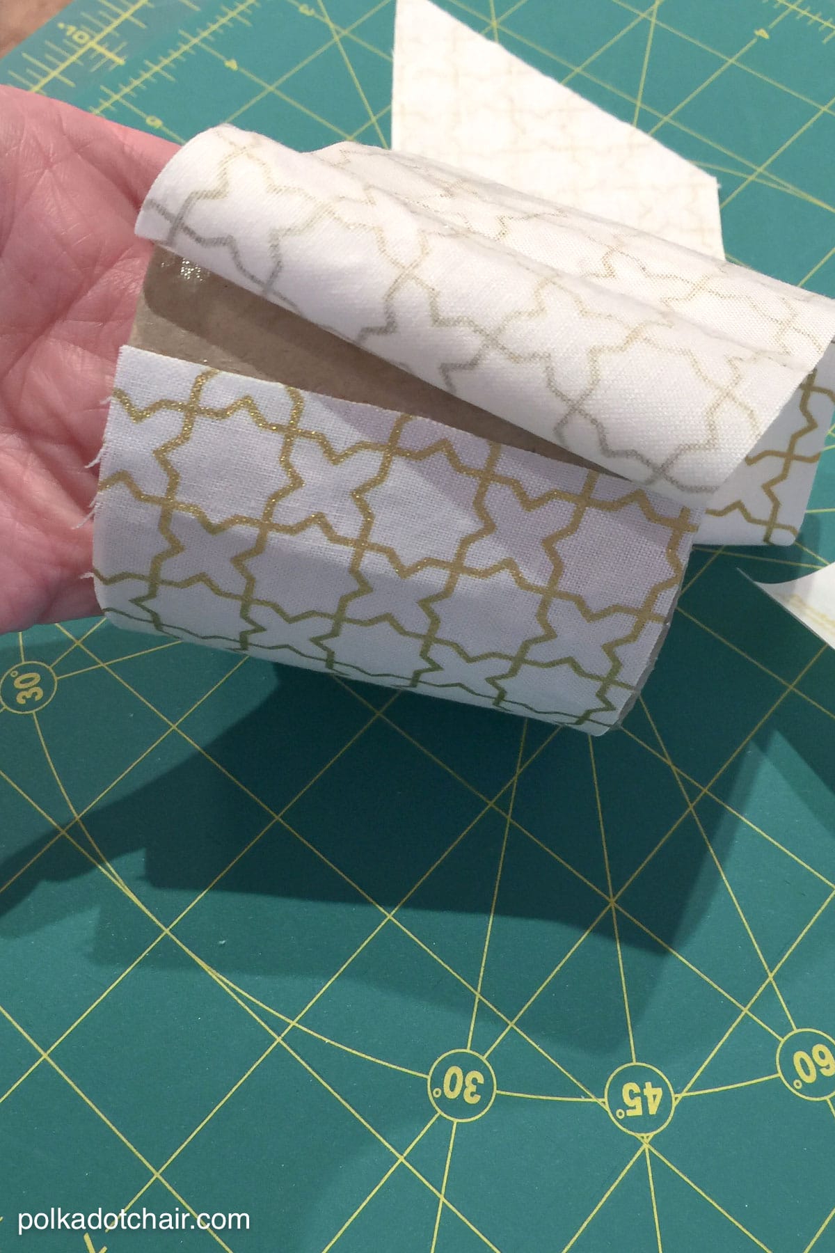 Learn how to cover paper mache boxes with fabric to make these cute DIY storage containers!