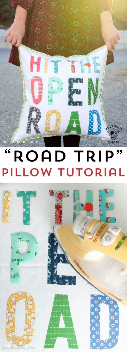 Hit the Open road pillow being held in front of an RV