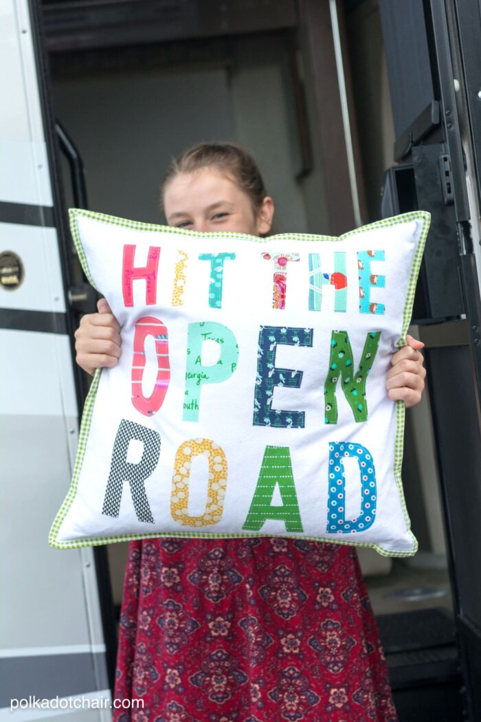 Free tutorial for a Hit the Open Road pillow, a fun DIY project for an RV or camper. Plus why our family loves to "Go RV'ing" - a pillow sewing tutorial (includes the templates for the letters)