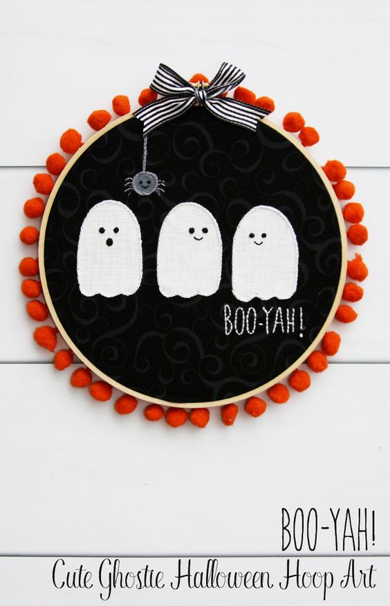 Embroidery hoop art with three ghosts