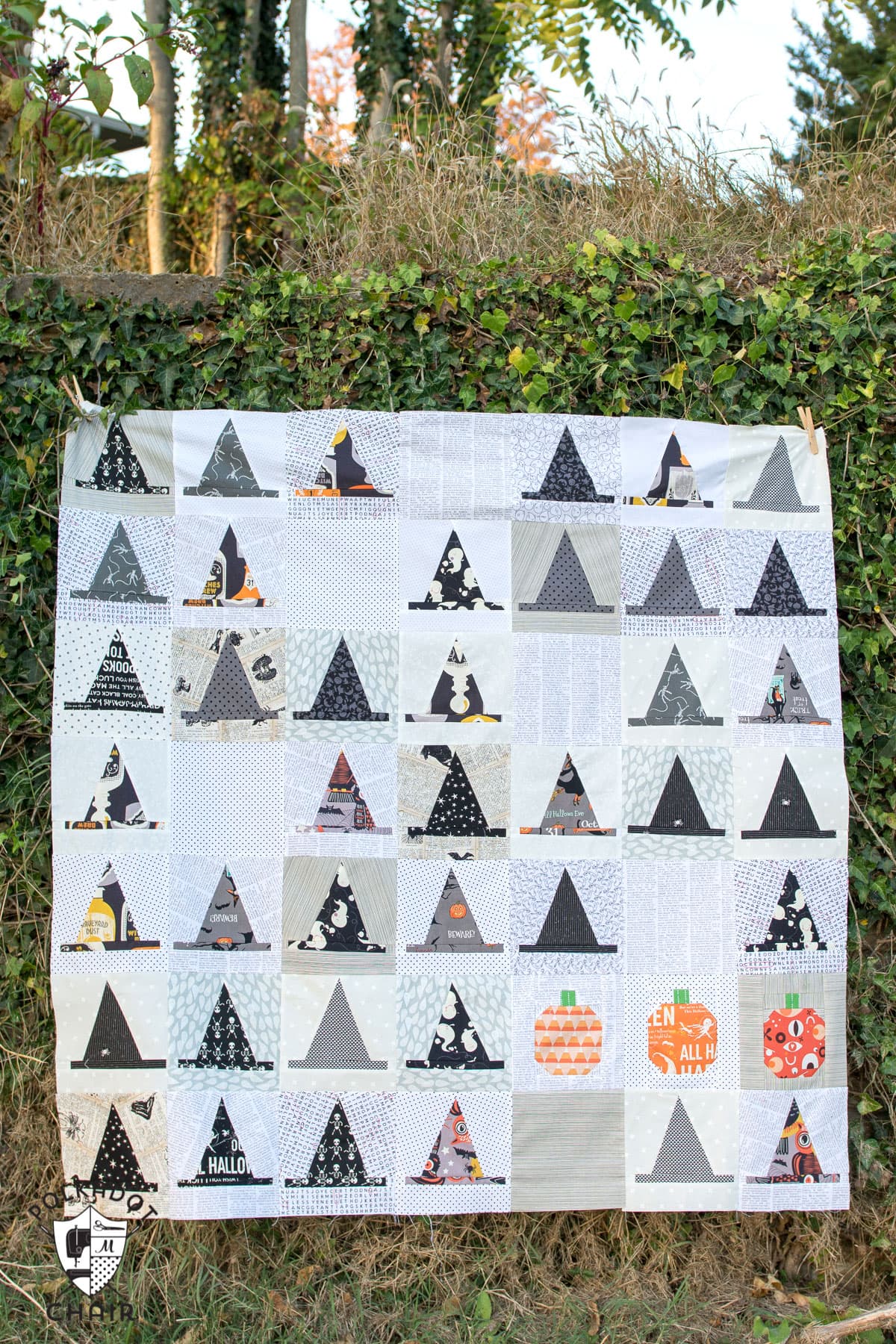 The Halloween Haberdashery Quilt; a fun Halloween sewing and quilting project featuring rows of Witch's Hat quilt blocks.