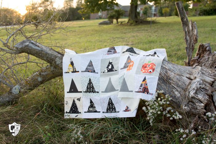 The Halloween Haberdashery Quilt; a fun Halloween sewing and quilting project featuring rows of Witch's Hat quilt blocks.