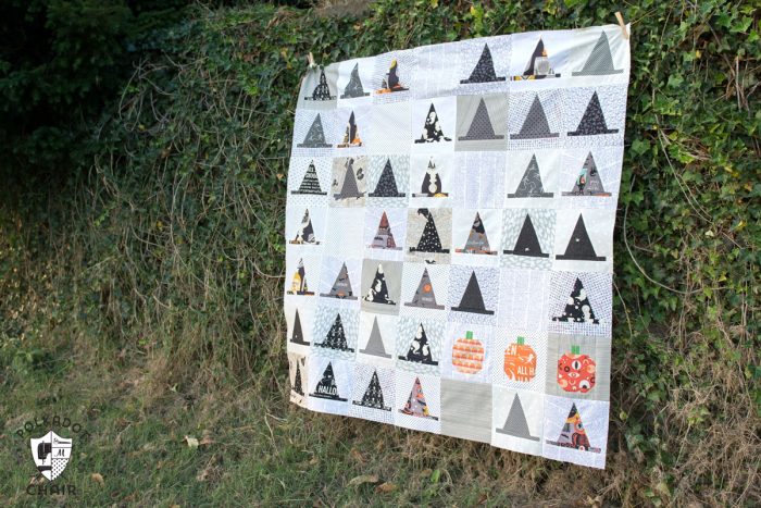 The Halloween Haberdashery Quilt; a fun Halloween sewing and quilting project featuring rows of Witch's Hat quilt blocks.
