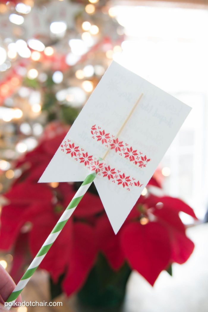 Cute Christmas Neighbor Gift ideas-a Poinsettia decorated with ornament tags and a Poinsettia poem attached - from polkadotchair.com