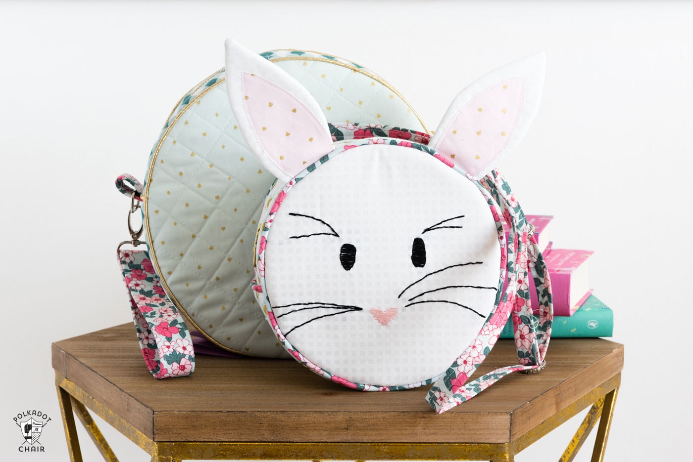 Introducing the Alice Bag Sewing Pattern. A whimsical and versatile purse sewing pattern featuring bunny ears! It can be made in two sizes and features 4 different handle style options including cross body straps! 