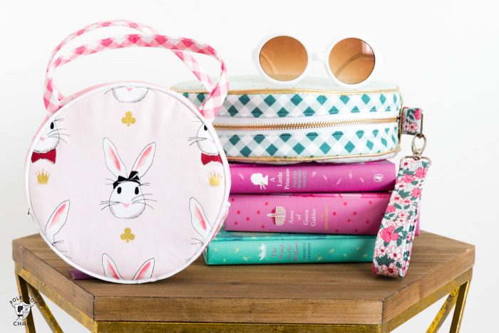 Introducing the Alice Bag Sewing Pattern. A whimsical and versatile purse sewing pattern featuring bunny ears! It can be made in two sizes and features 4 different handle style options including cross body straps! 