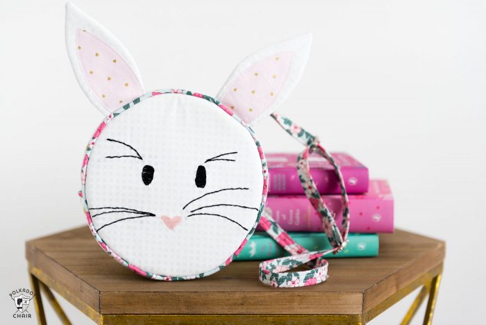 Introducing the Alice Bag Sewing Pattern. A whimsical and versatile purse sewing pattern featuring bunny ears! It can be made in two sizes and features 4 different handle style options including cross body straps! 