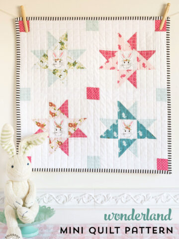 Wonderland; A free mini quilt pattern - would be so cute hung up as a decor in a Children's room - features Wonderland Fabric by Melissa Mortenson of polkadotchair.com