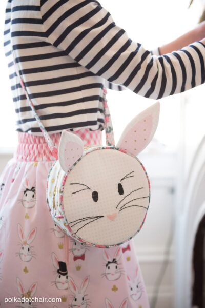 Introducing the Alice Bag Sewing Pattern. A whimsical and versatile purse sewing pattern featuring bunny ears! It can be made in two sizes and features 4 different handle style options including cross body straps!