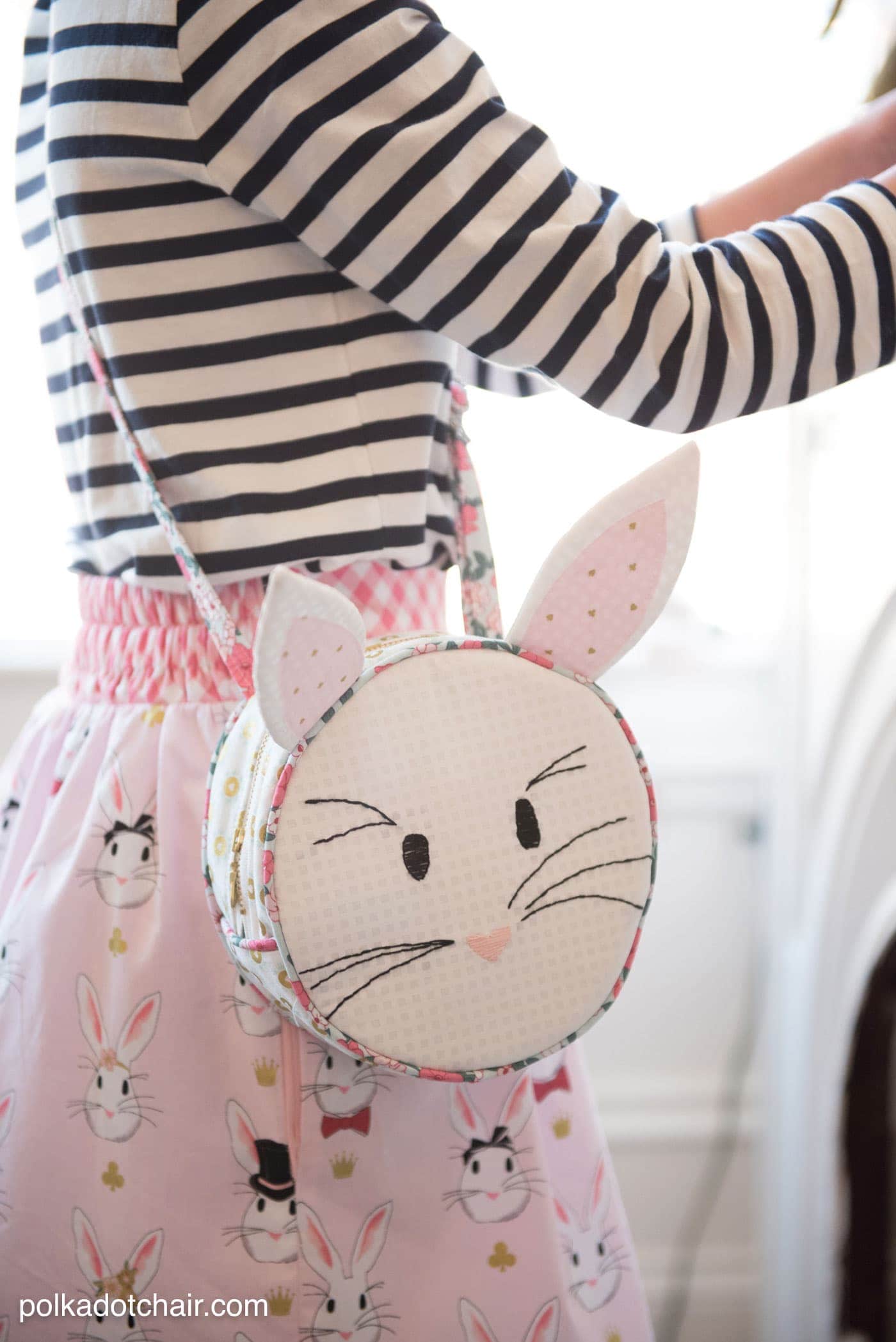 Introducing the Alice Bag Sewing Pattern. A whimsical and versatile purse sewing pattern featuring bunny ears! It can be made in two sizes and features 4 different handle style options including cross body straps!