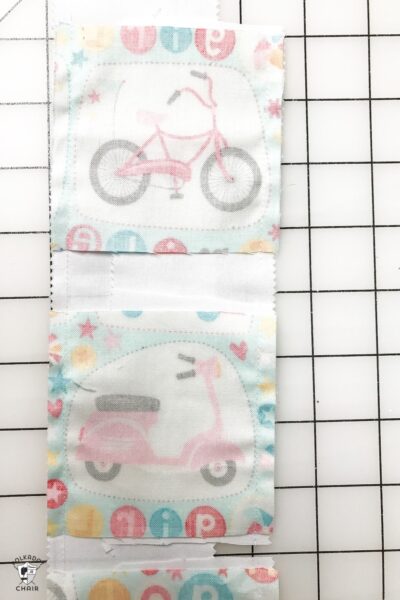 strips of colorful fabric on white cutting mat