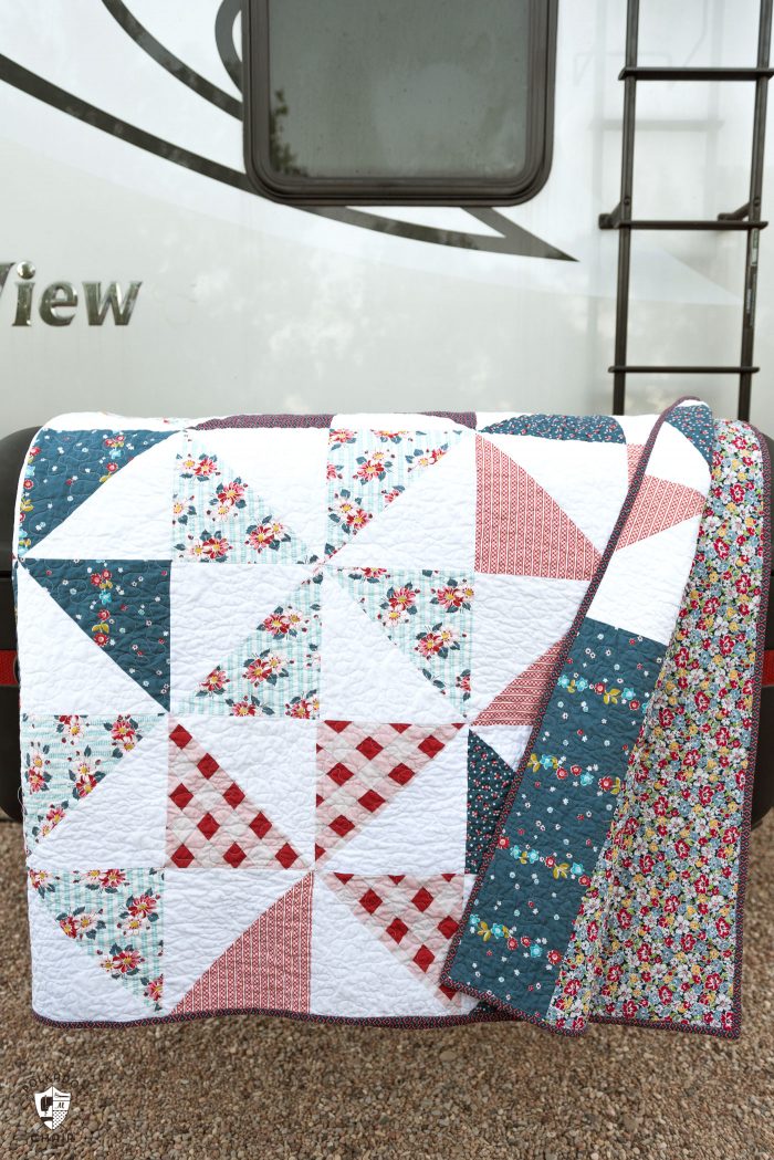 Summertime Pinwheel Quilt - so easy you can make it with a bunch of layer cakes or 10" stackers. A simple summer quilt to make