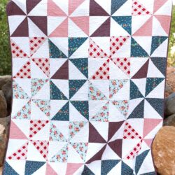 Summertime Pinwheel Quilt - so easy you can make it with a bunch of layer cakes or 10" stackers. A simple summer quilt to make