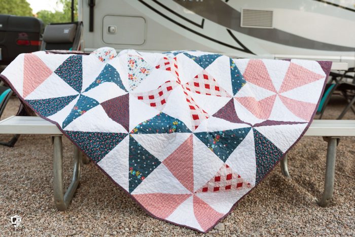 Summertime Pinwheel Quilt - so easy you can make it with a bunch of layer cakes or 10" stackers. A simple summer quilt to make