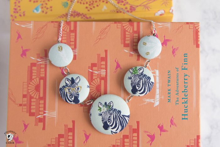 Make a cute statement necklace with this fabric covered button necklace tutorial by Melissa Mortenson of polkadotchair.com 