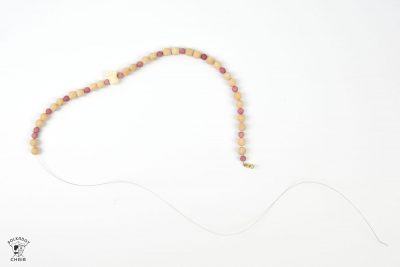 Fun and easy DIY Beaded Tassel necklace with covered button! Learn how to make a tassel necklace with this simple jewelry tutorial