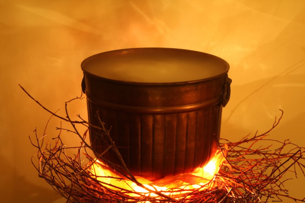 faux planter made to look like halloween cauldron