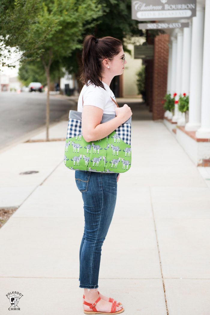 The March Bag sewing pattern has been updated and re-released. It's a fun handbag sewing pattern with a large outside kangaroo style pocket and 4 different handle styles. #sewingpattern #bagpattern #handbagpattern #pursepattern #polkadotchair #melissamortenson #rileyblake #safariparty