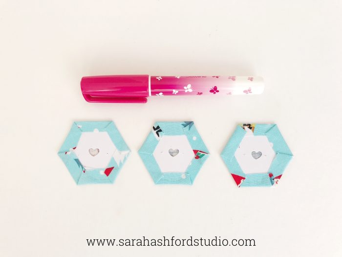 Super cute Christmas Hexie Tea Towel tutorial by Sarah Ashford. Such a fun Christmas gift idea ; learn how to sew hexagons! #christmasgifts #christmassewing #hexies #hexagons #hexagontutorial #christmasfabric #teatowel