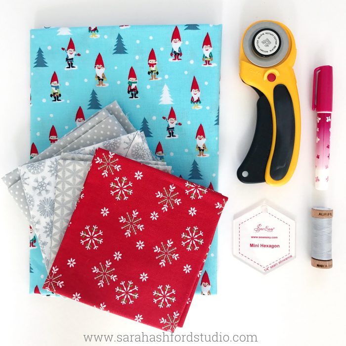 Super cute Hexie Christmas Tea Towel tutorial by Sarah Ashford. Such a fun Christmas gift idea ; learn how to sew hexagons! #christmasgifts #christmassewing #hexies #hexagons #hexagontutorial #christmasfabric #teatowel