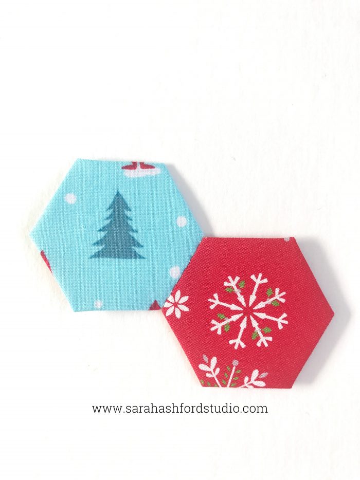 Super cute Christmas Hexie Tea Towel tutorial by Sarah Ashford. Such a fun Christmas gift idea ; learn how to sew hexagons! #christmasgifts #christmassewing #hexies #hexagons #hexagontutorial #christmasfabric #teatowel