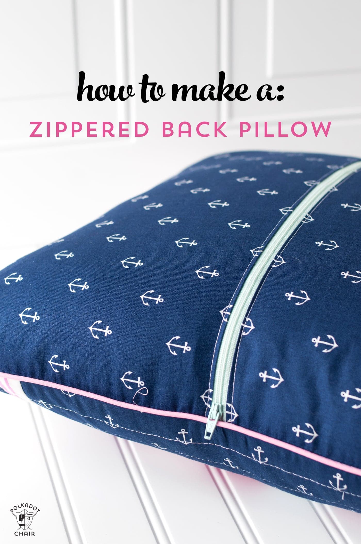 close up of blue and white pillow with pink zipper