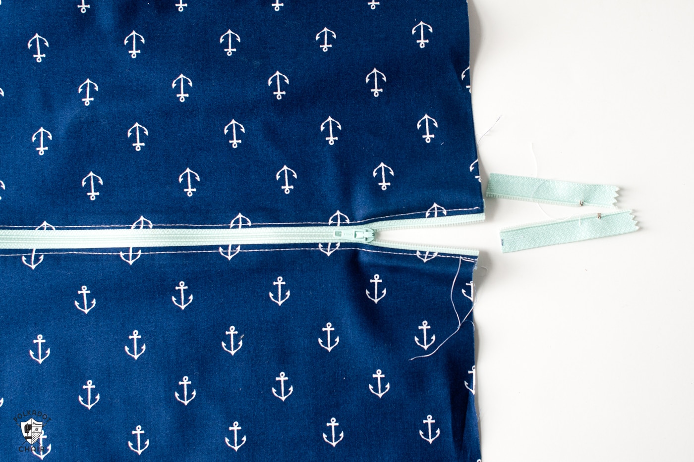 blue fabric with aqua zipper