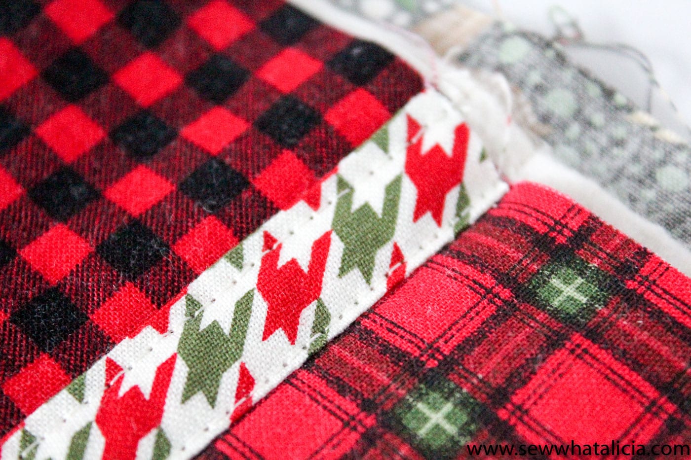 Free Reverse Applique Christmas Table Runner Pattern - such a cute and fun Christmas craft or sewing project #tablerunner #tablerunnerpattern #christmas #ChristmasDecor #ChristmasCraft #ChristmasProject