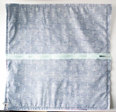 Learn how to add a zipper to the back of a pillow - a free sewing tutorial. So easy, you can do it for any size pillow!