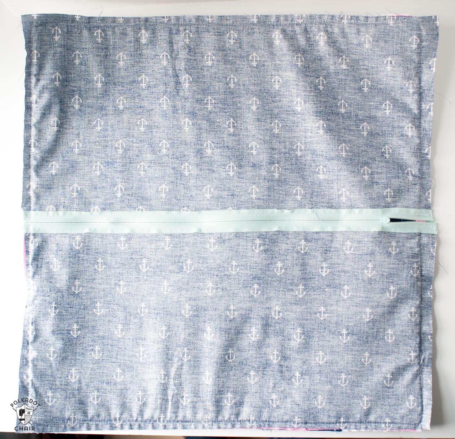 Pillow wrong side out with sewn sides on white table