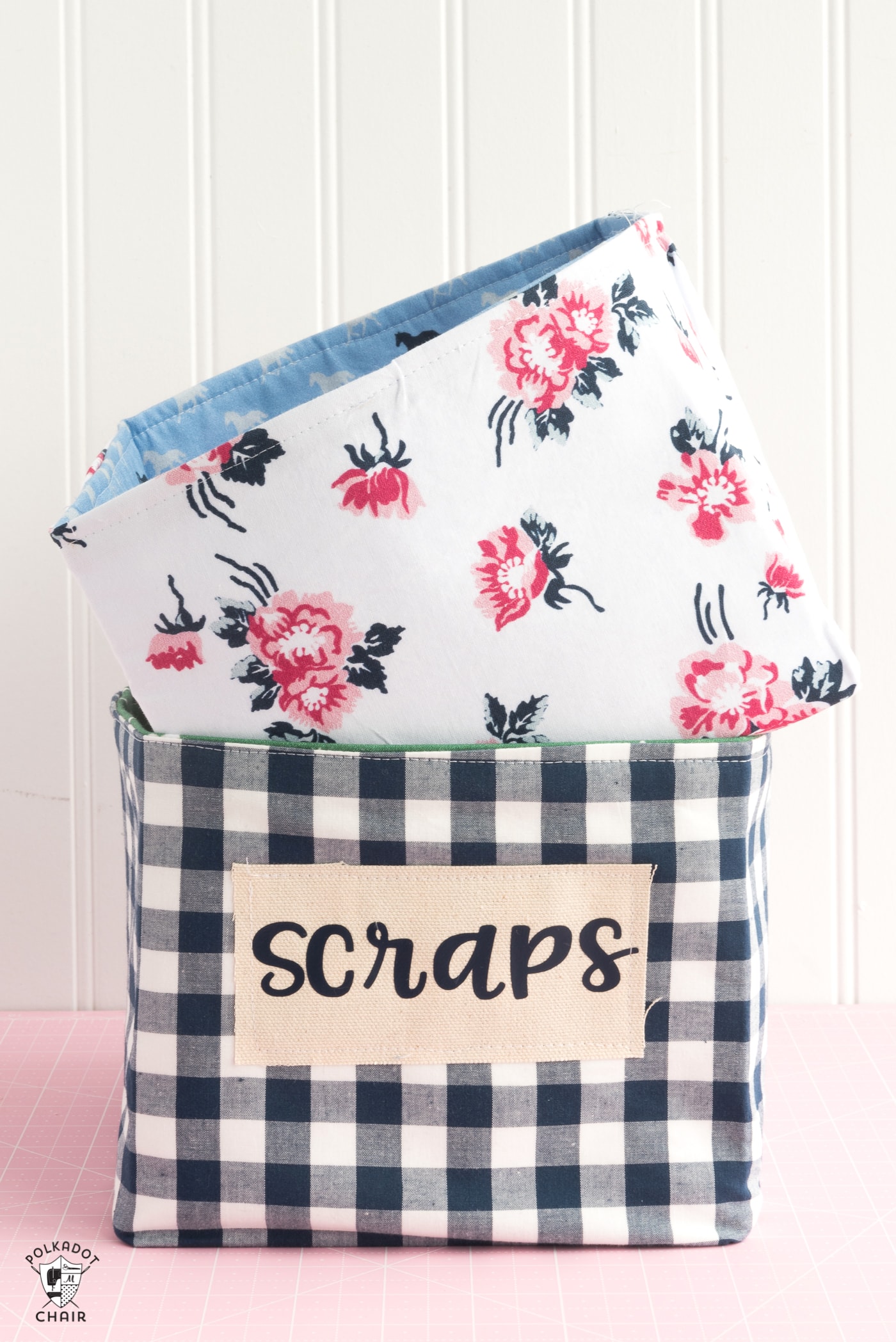Stacked fabric baskets on pink table