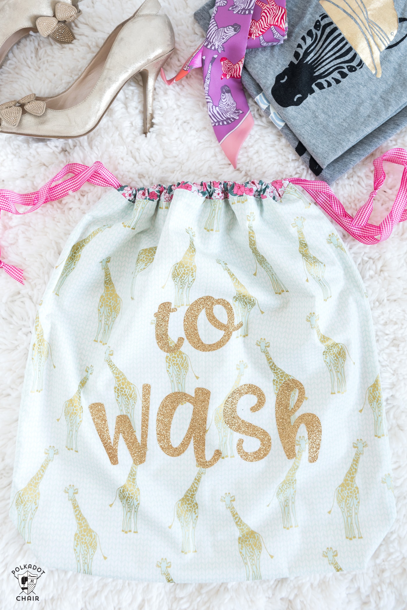 Free tutorial and Lined Drawstring Bag Sewing Pattern - how to sew a reversible drawstring bag and add cute sayings to the front! Includes free cricut cut file downloads #sewing #sewingpattern #drawstringbag #laundrybag #cricut #cricutmade #ad