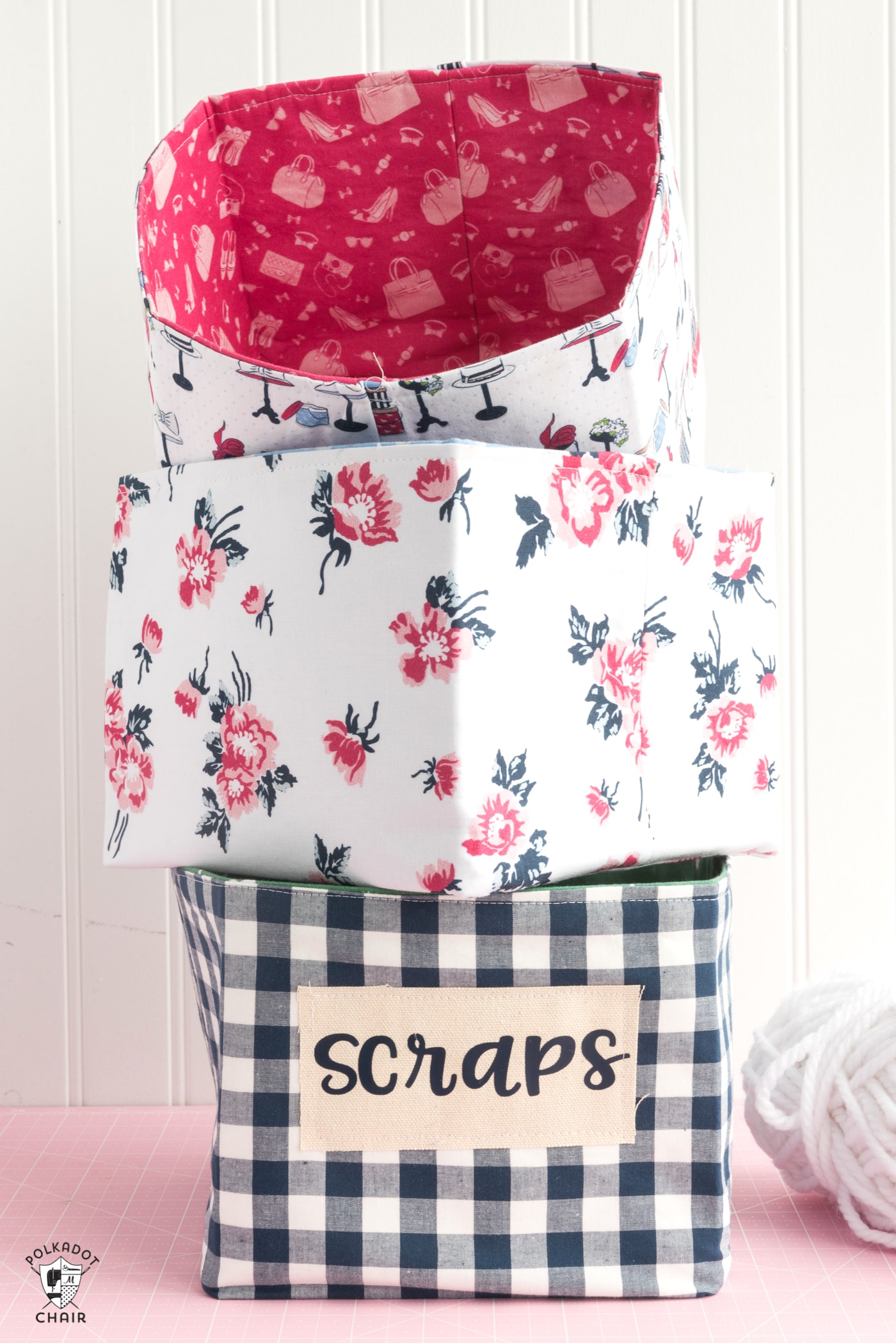 Stacked fabric baskets on pink table