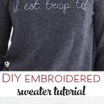 Learn how to make a DIY Embroidered sweater with a fun french quote on it. Includes free embroidery pattern for the quote. A clever way to refashion an old sweater. #DIYEmbroidery #DIYFashion #embroideredsweater #tutorial