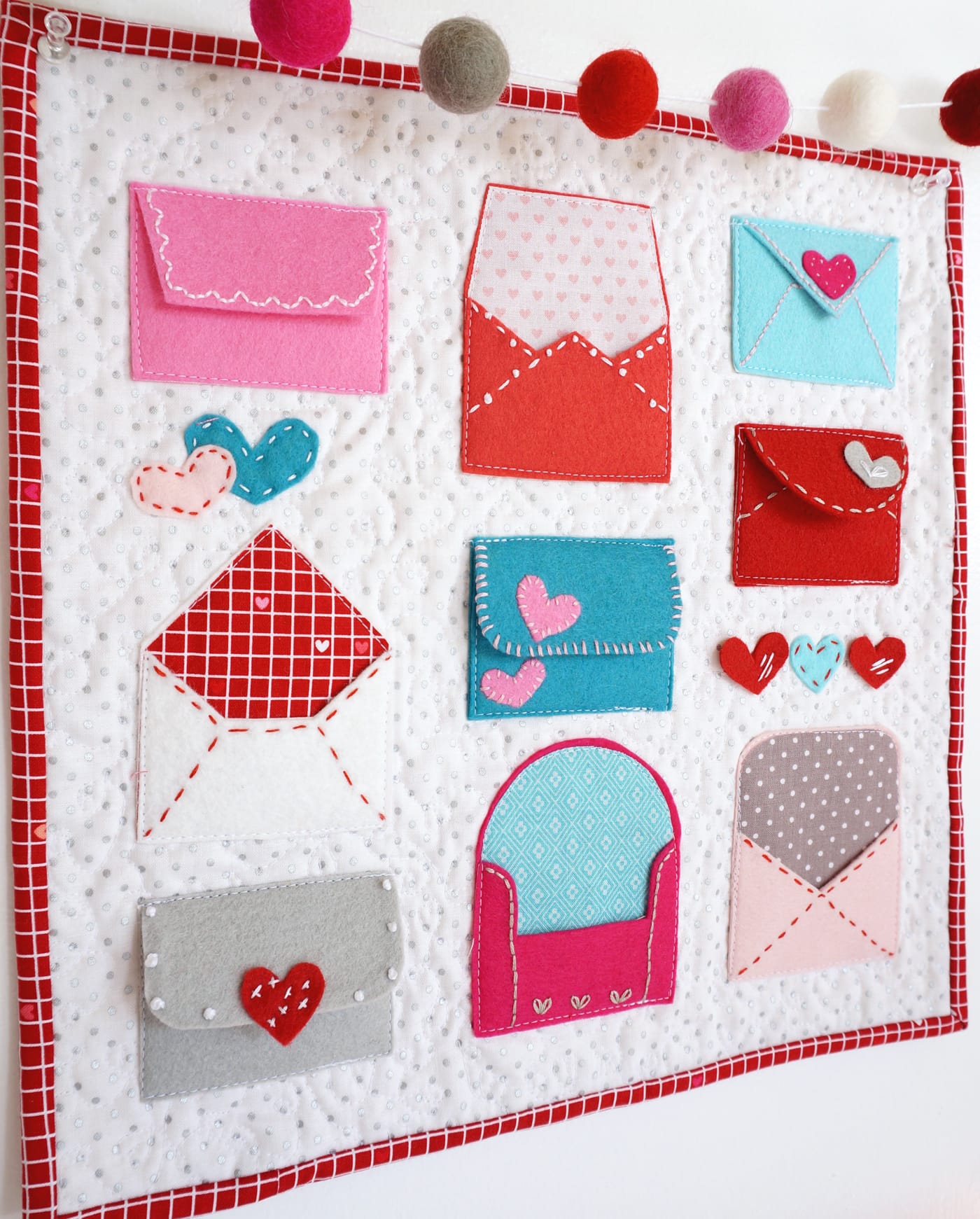 A free pattern for "Love Notes" a Valentine's Day Craft idea. A felt envelope tutorial - with hand embroidery and felt applique #ValentinesDay #ValentinesDayCraft #FeltEnvelope #FeltCrafts #FeltProject #EmbroideryHoopArt