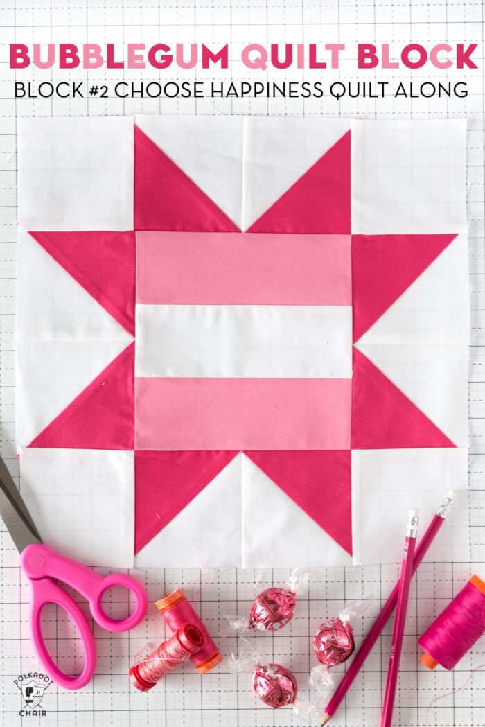 Light pink and dark pink Quilt block on white table.