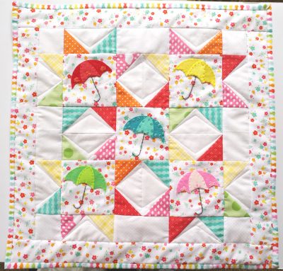colorful sawtooth star mini quilt