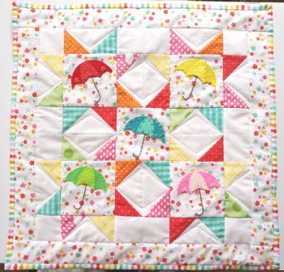 colorful sawtooth star mini quilt
