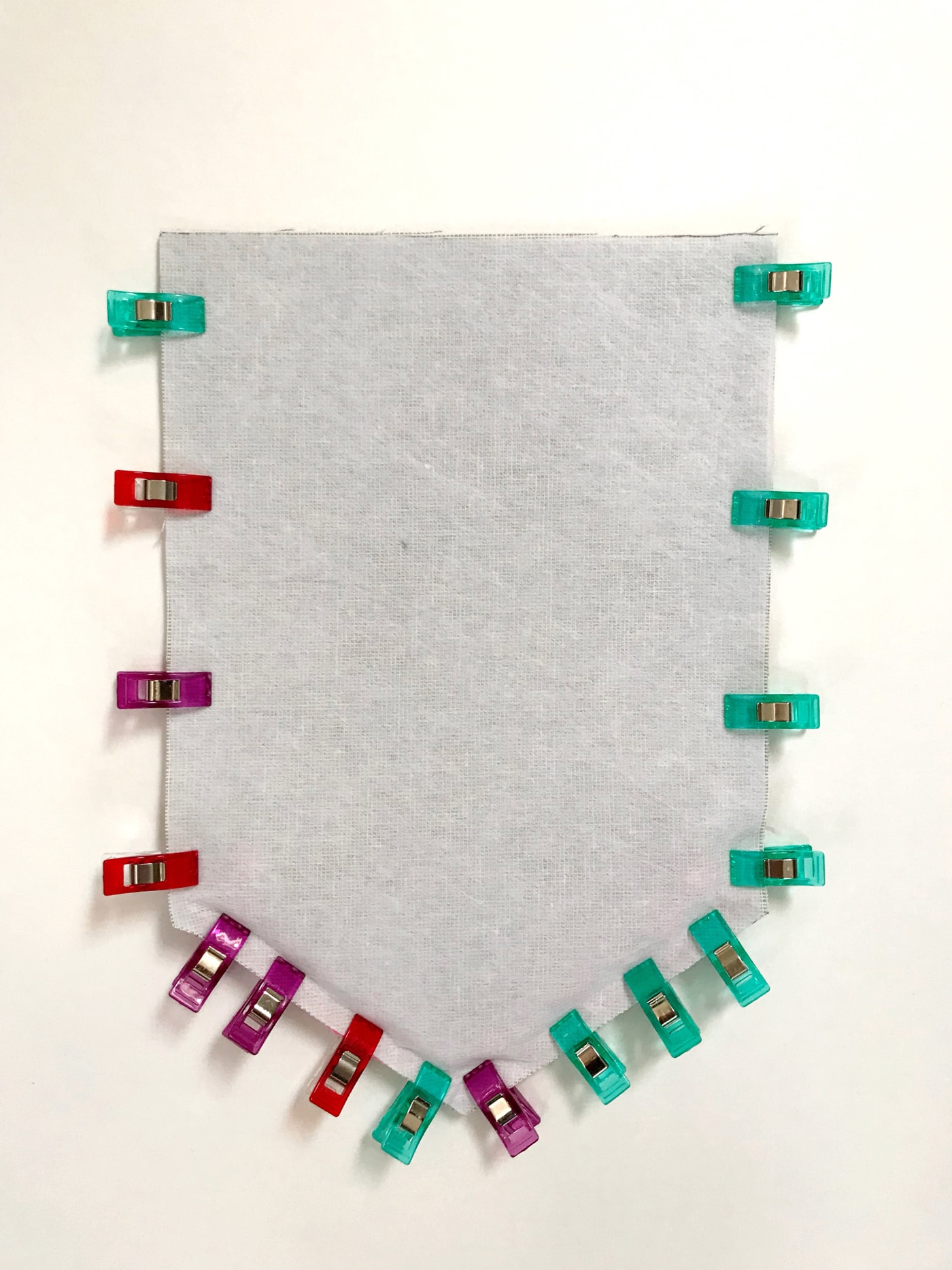 A great enamel pin display idea! Create a banner for your favorite pins with this DIY Enamel Pin Banner Tutorial. #enamelpins #sewingtutorial #pindisplayideas #bannertutorials #canvasbannertutorial